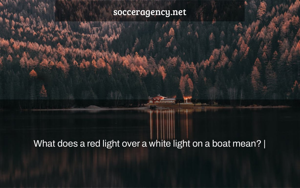 What does a red light over a white light on a boat mean? |
