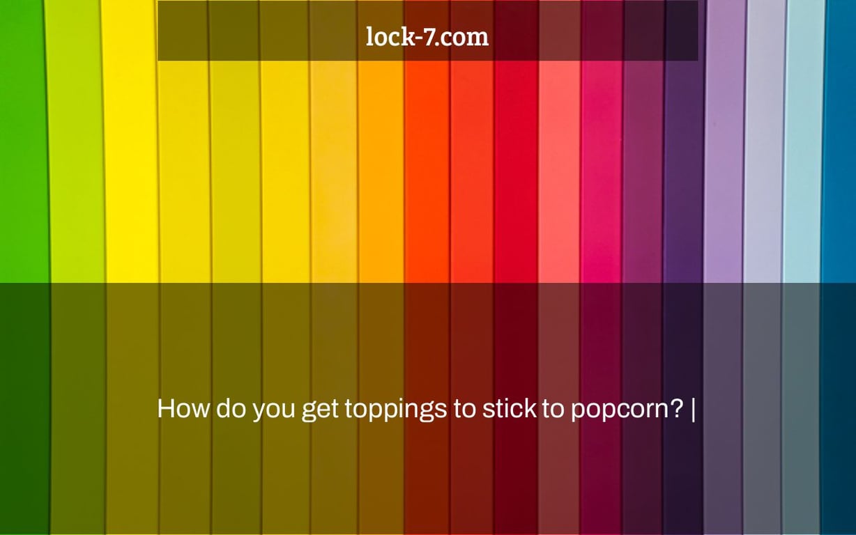How do you get toppings to stick to popcorn? |