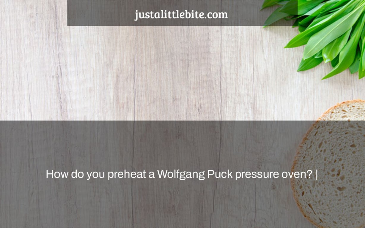 How do you preheat a Wolfgang Puck pressure oven? |