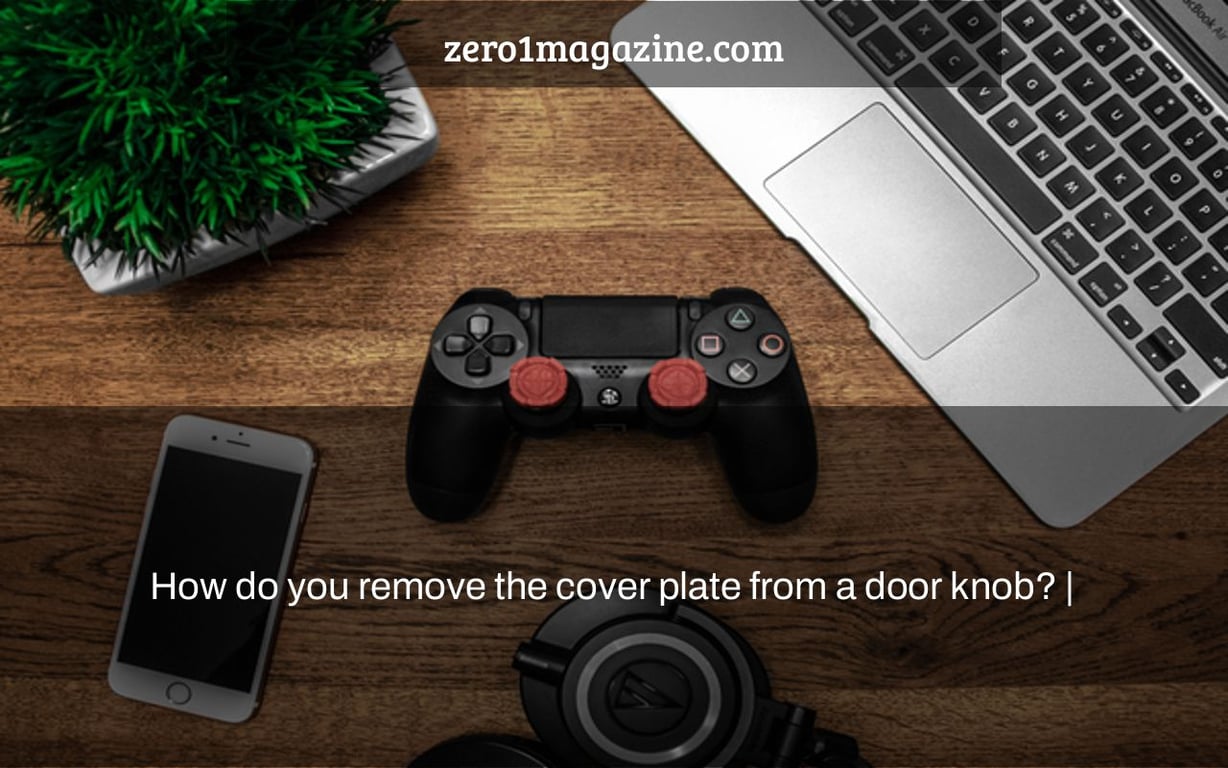 How do you remove the cover plate from a door knob? |