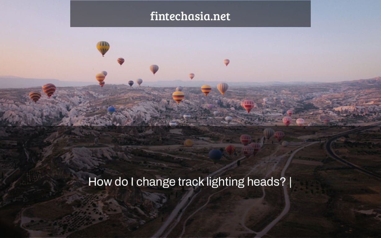 How do I change track lighting heads? |