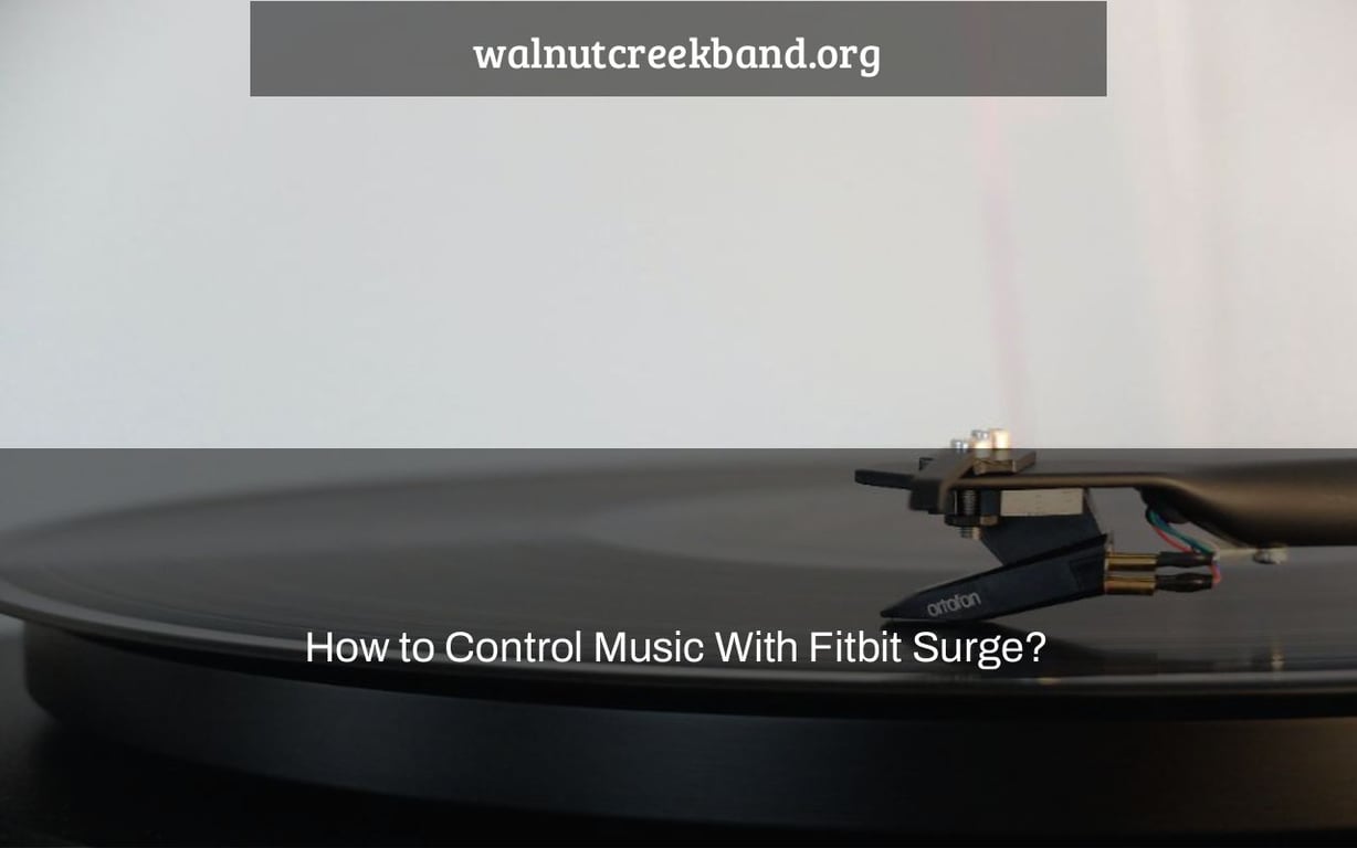 How to Control Music With Fitbit Surge?