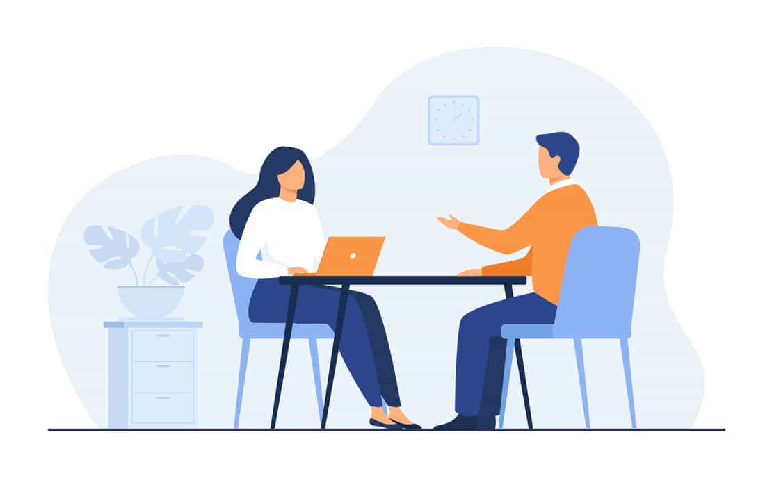Minh hoạ hai người ngồi đối diện trò chuyện trong một buổi coaching