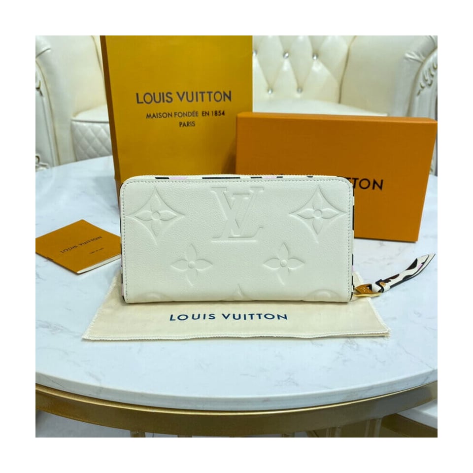 Louis Vuitton Monogram Empreinte Leather with Animal-Print Zippy Wallet Cream view 5
