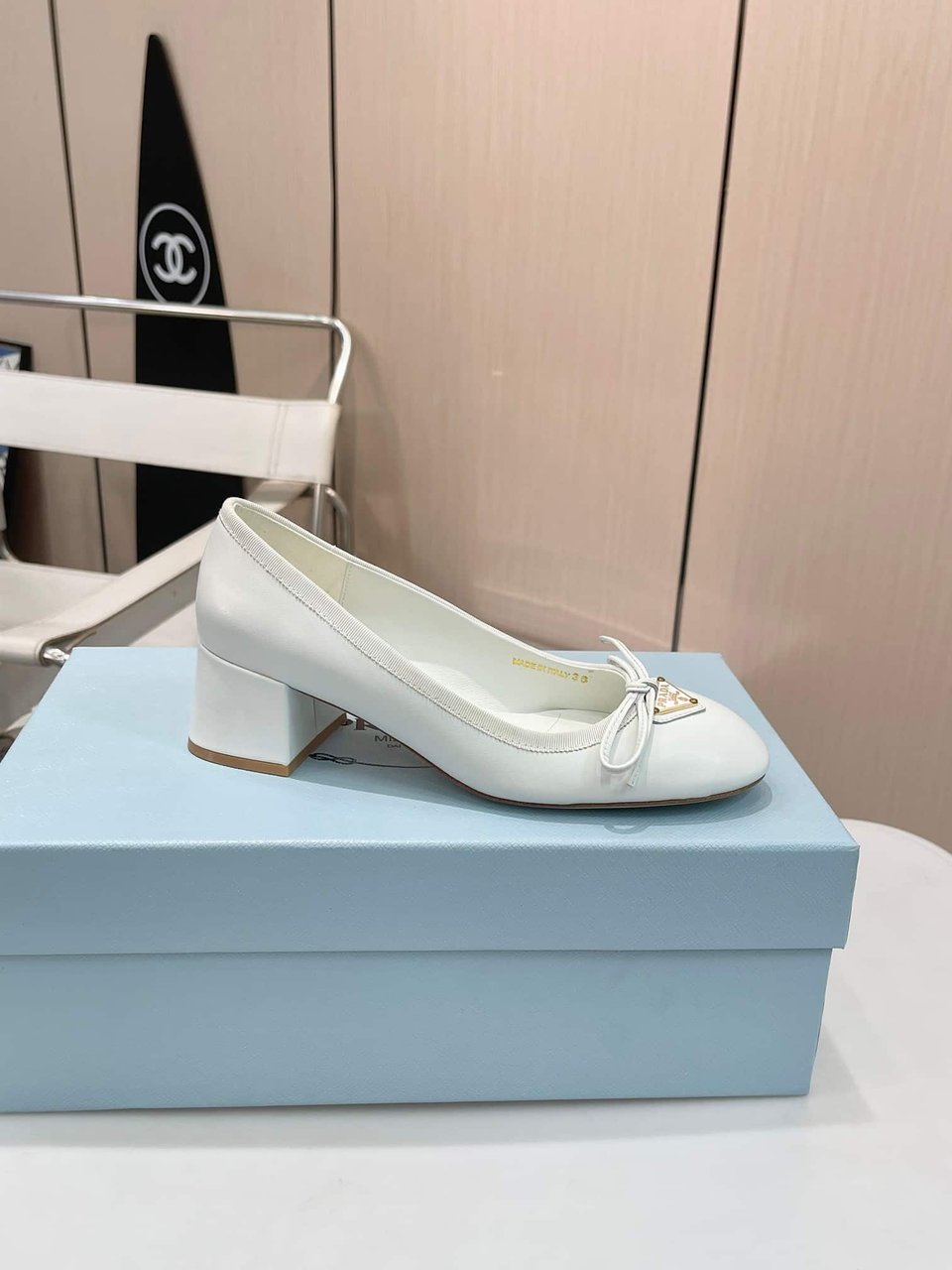 Prada Triangle Logo Bow Pump In White view 7