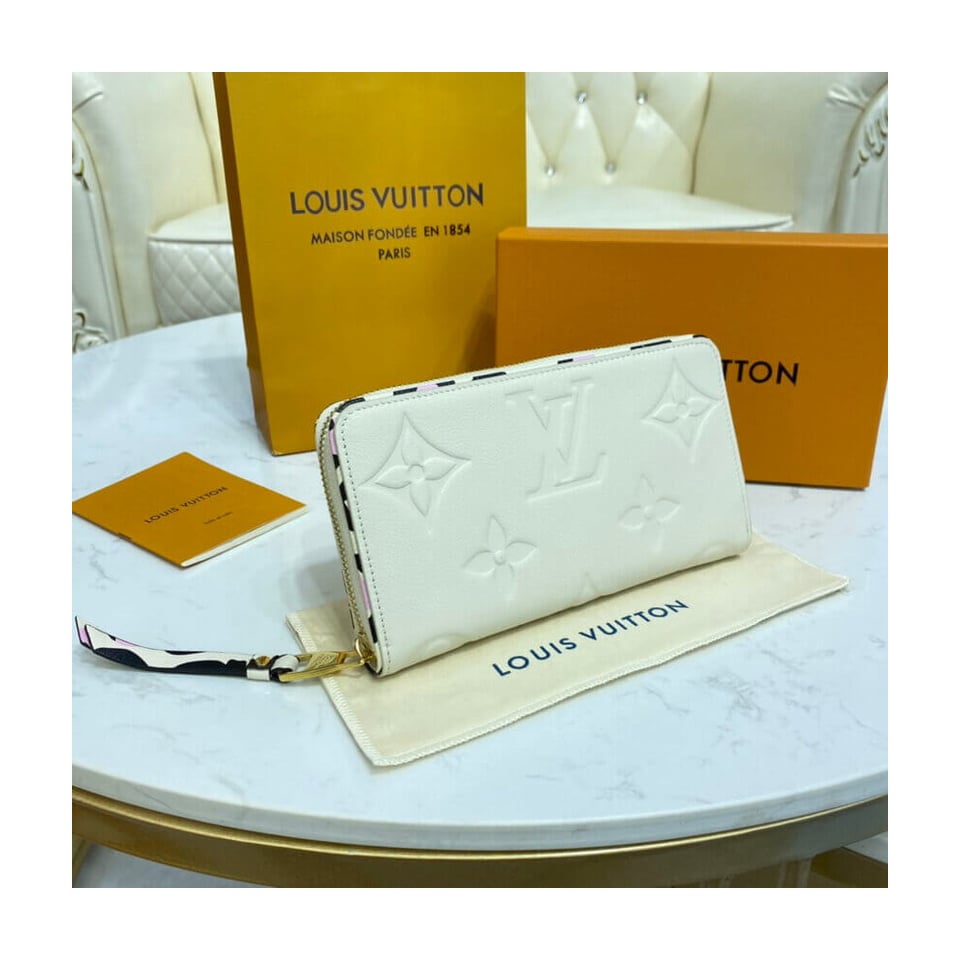 Louis Vuitton Monogram Empreinte Leather with Animal-Print Zippy Wallet Cream view 4