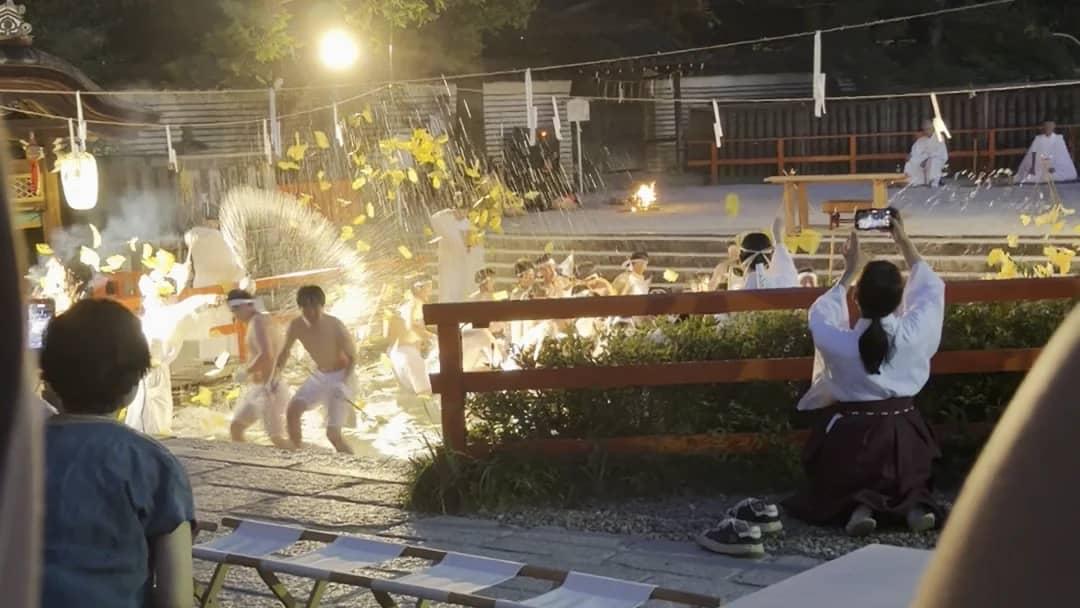Men rushing into Mitarashi Pond during the Yatori Shinji ritual at Shimogamo Shrine
