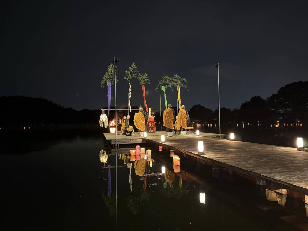 The stage on Osawa Pond reflected in the water at night