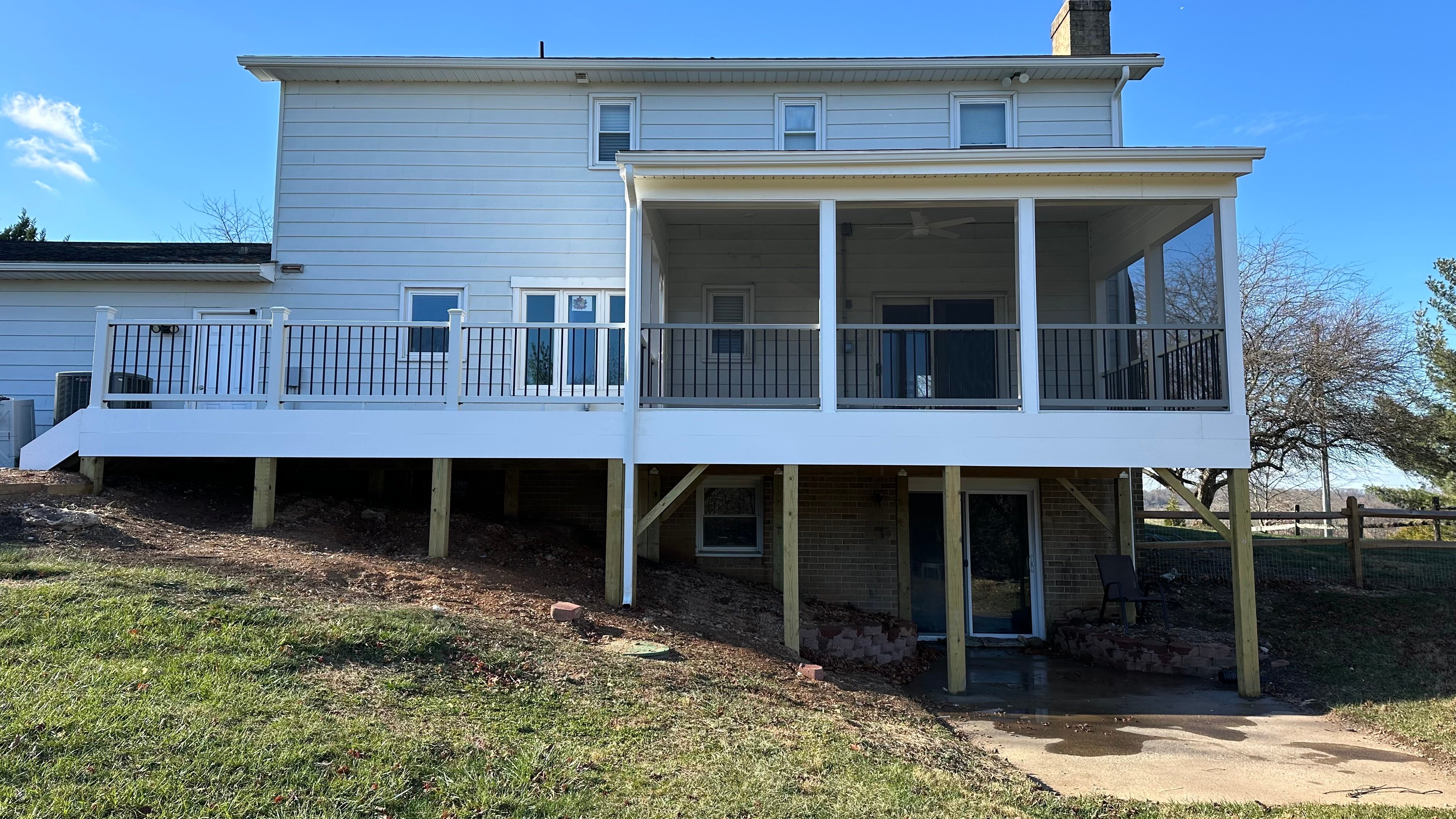 Upgryd custom deck with white fascia and spiced rum decking, perfect for outdoor living.