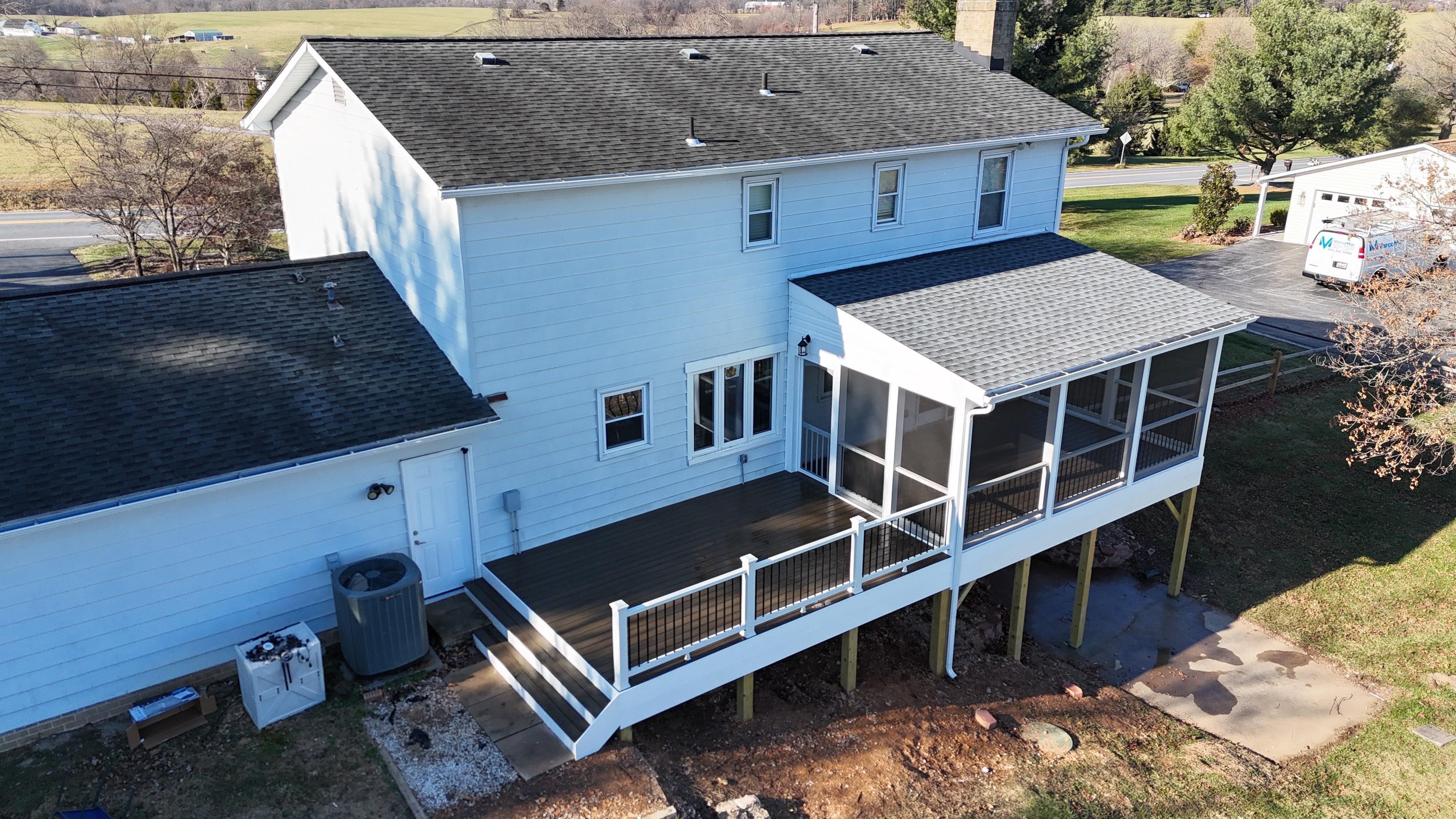 Upgryd custom deck with TimberTech T-rails on a porch in Schnecksville, PA.