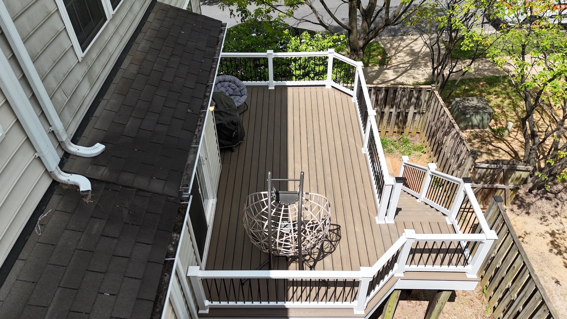 Upgryd deck resurfacing project featuring Trex decking with a tide pool design and PVC fascia.