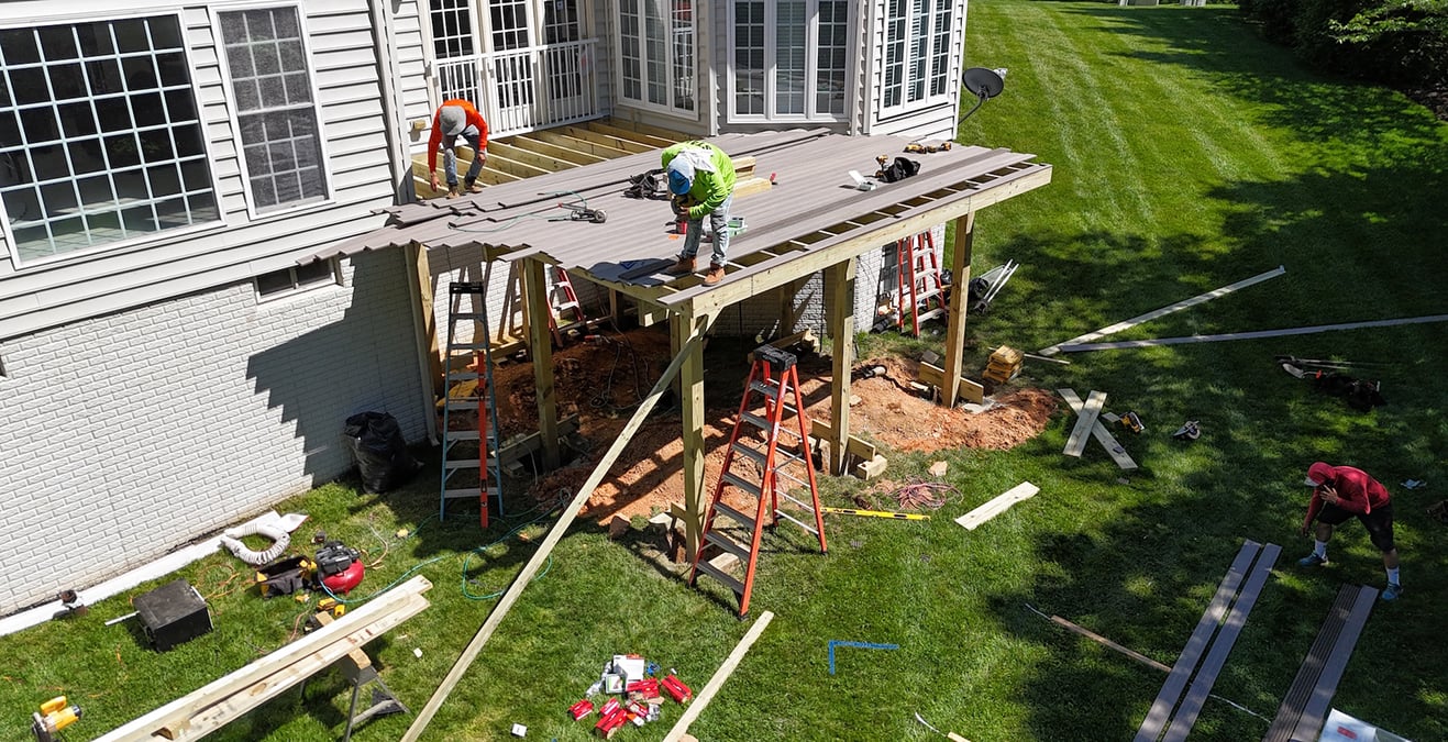 Upgryd custom deck featuring Trex decking in a rocky harbor setting, showcasing expert deck construction in Bethlehem, PA.