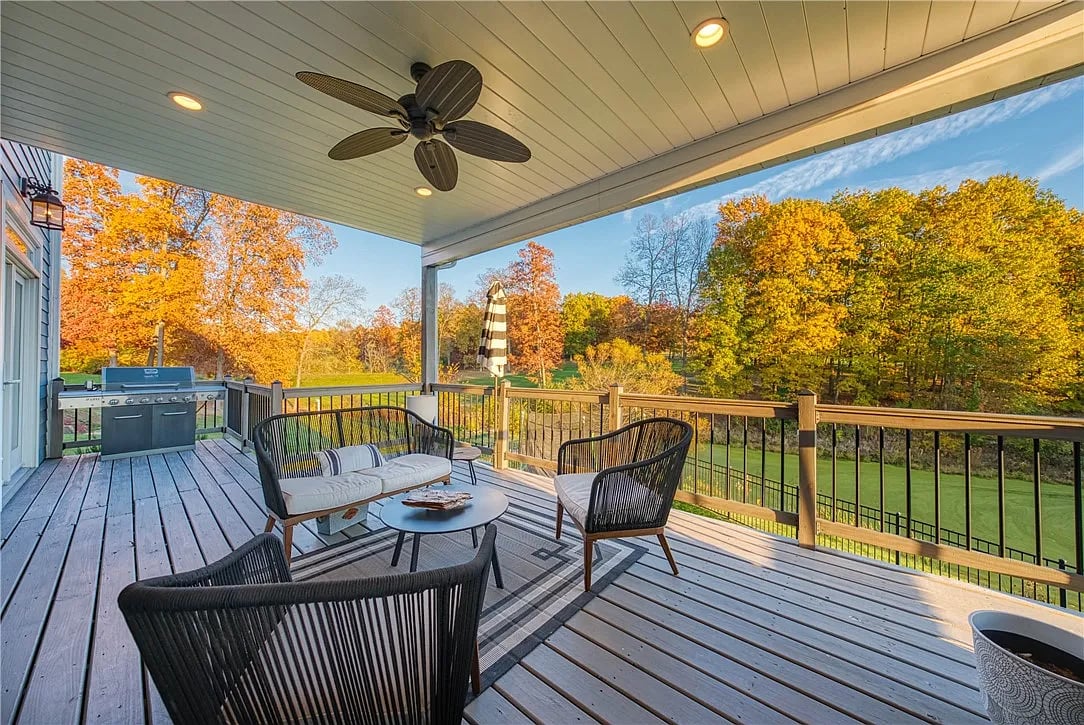 Upgryd custom deck with a fireplace and stunning views in Pennsburg, PA.