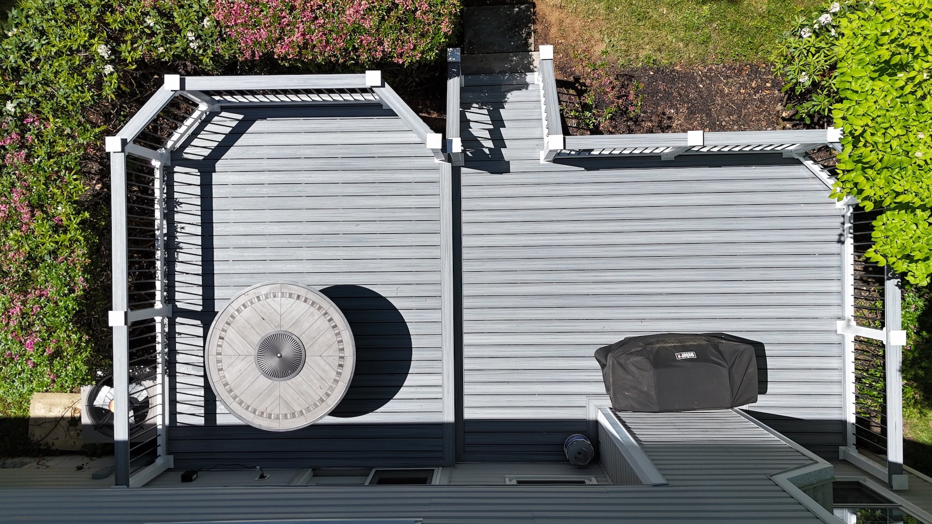 Aerial view of resurfaced deck in Allentown, PA using Trex Enhance Foggy Wharf with RDI vinyl railings.