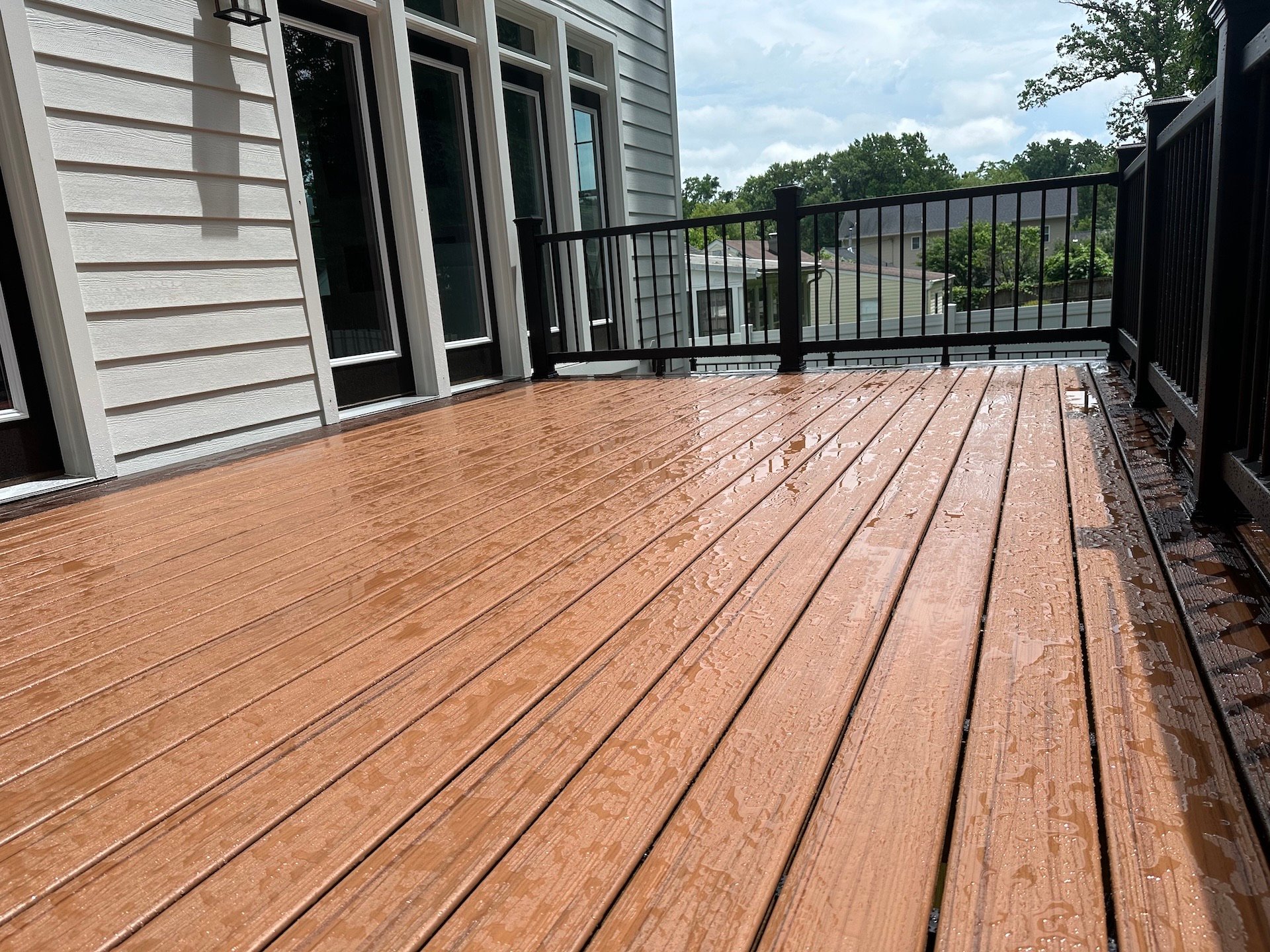 Upgryd custom deck with Trex decking, Tiki torch, and detailed deck closeup in Breinigsville