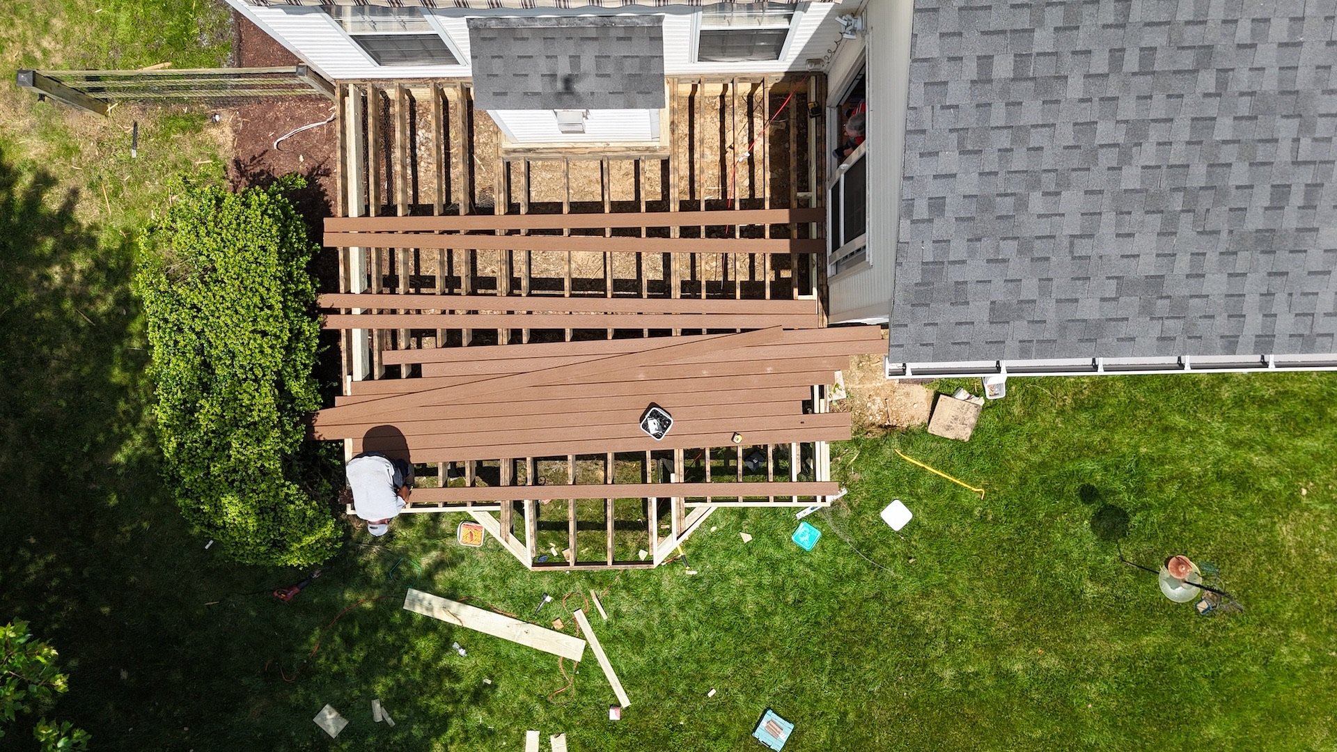 An overhead shot of deck surface replacement in progress featuring Trex Select Saddle boards.