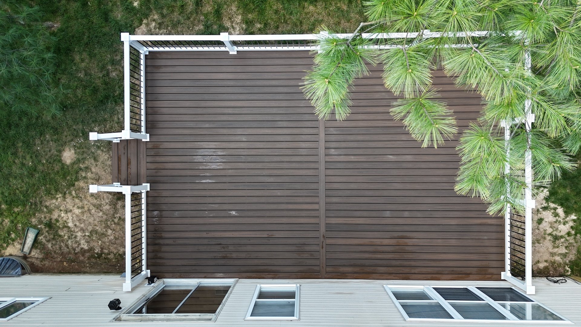 Upgryd Deckorators Voyage Khaya Deck Overview showcasing a stunning outdoor living space, highlighting the intricate deck design and premium materials used.