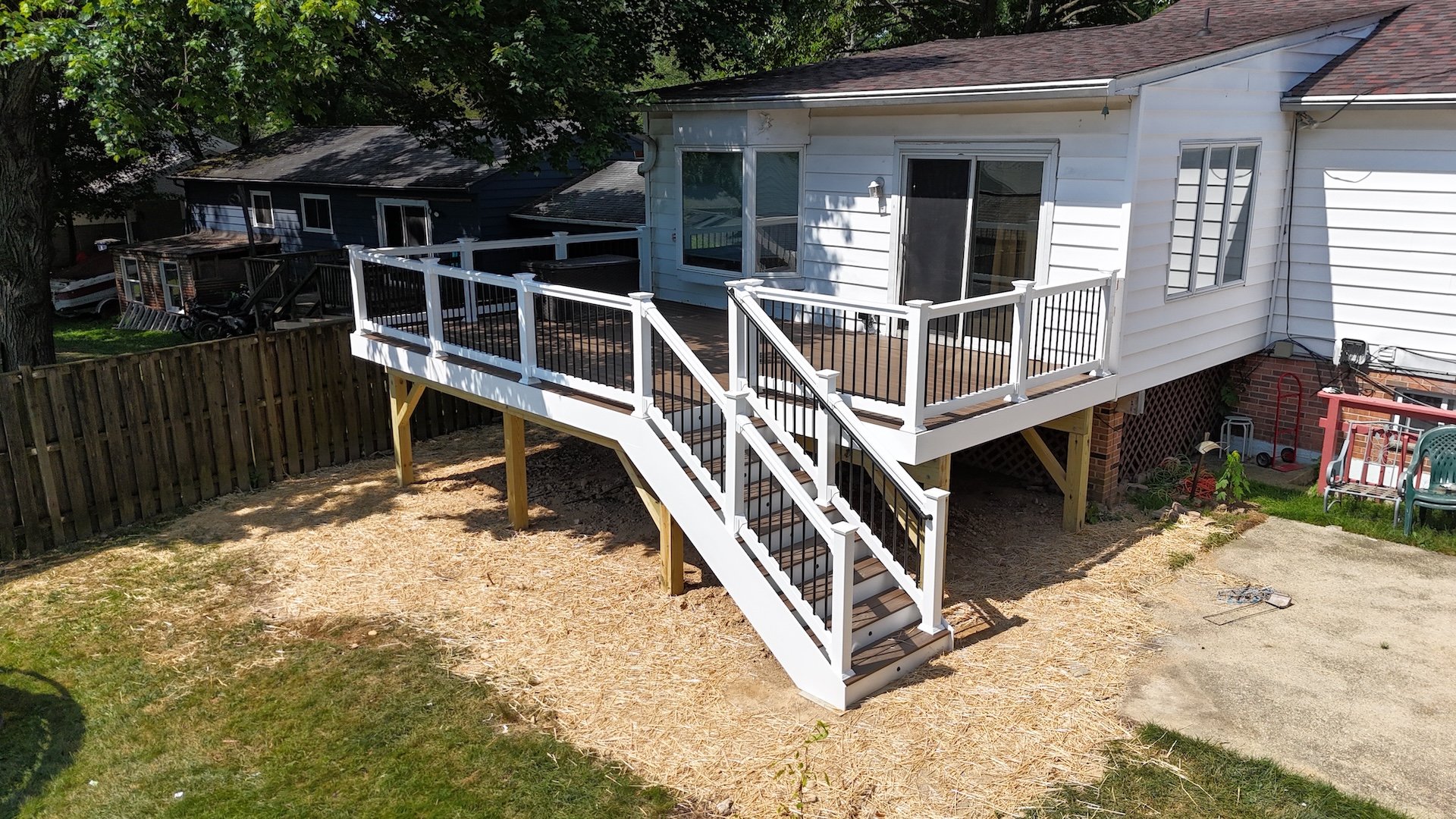 Side angle view of Easton deck with clean white PVC fascia and structural framing.