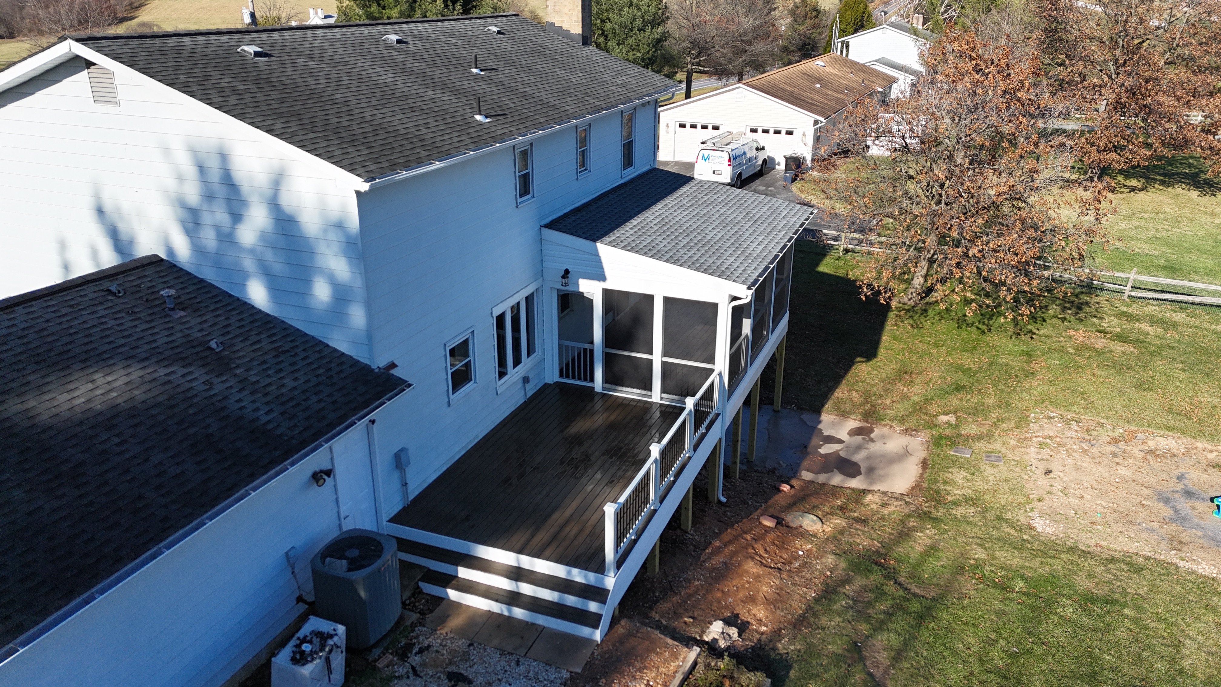 Upgryd's Spiced Rum Decking: A breathtaking aerial view showcasing a meticulously crafted deck in Schnecksville, PA, featuring rich, warm tones and expert design.