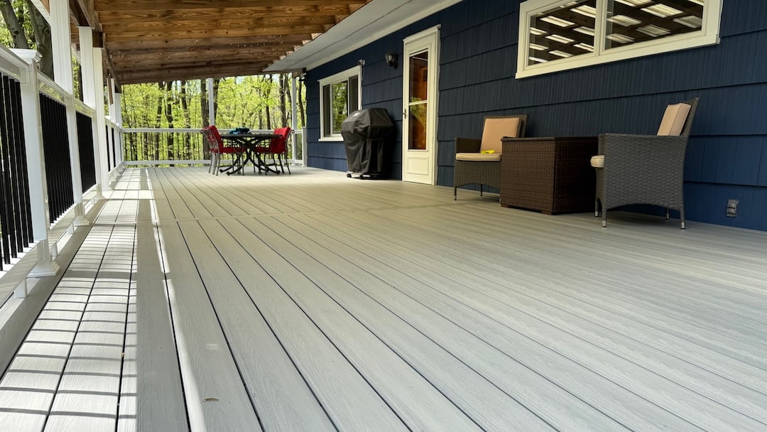 Upgryd custom deck featuring Deckorators Venture Saltwater decking in Milford, NJ.
