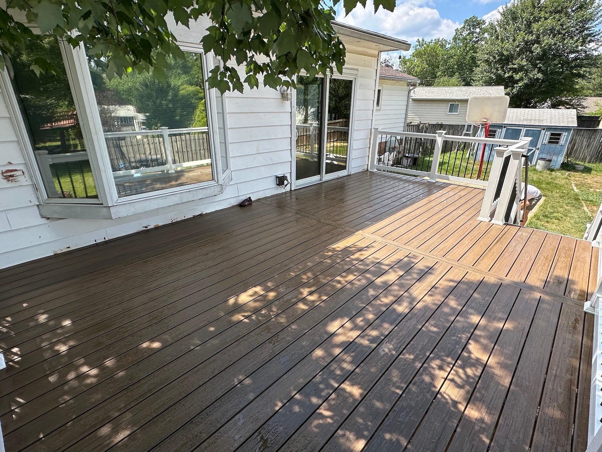Upgryd composite deck with Deckorators Voyage Khaya decking