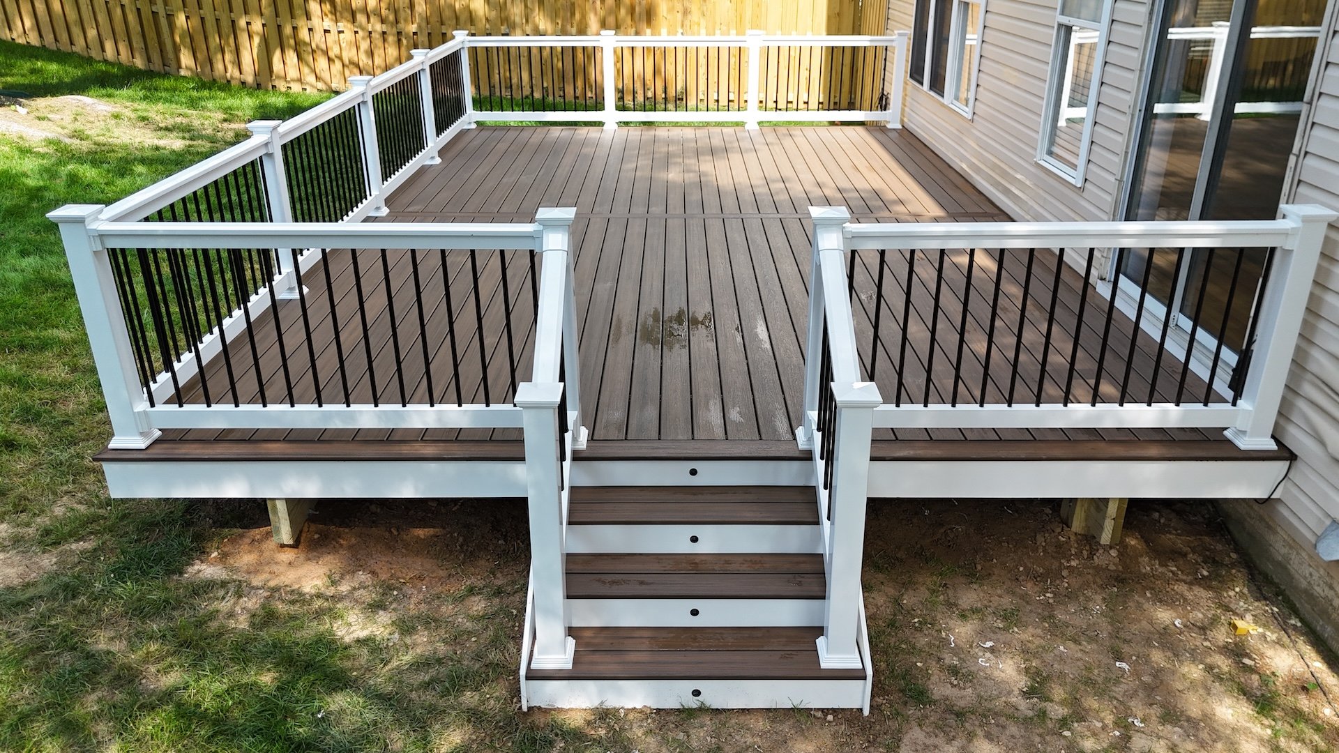 Upgryd custom deck with backyard view in Nazareth, PA, showcasing TimberTech decking.