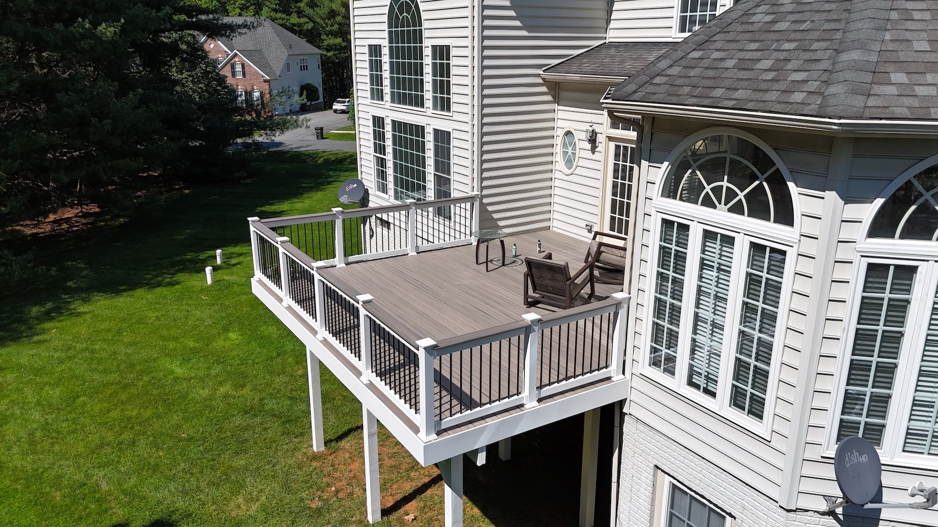 Upgryd's Trex deck in Rocky Harbor with a side-angle view, showcasing a Bethlehem, PA deck design.