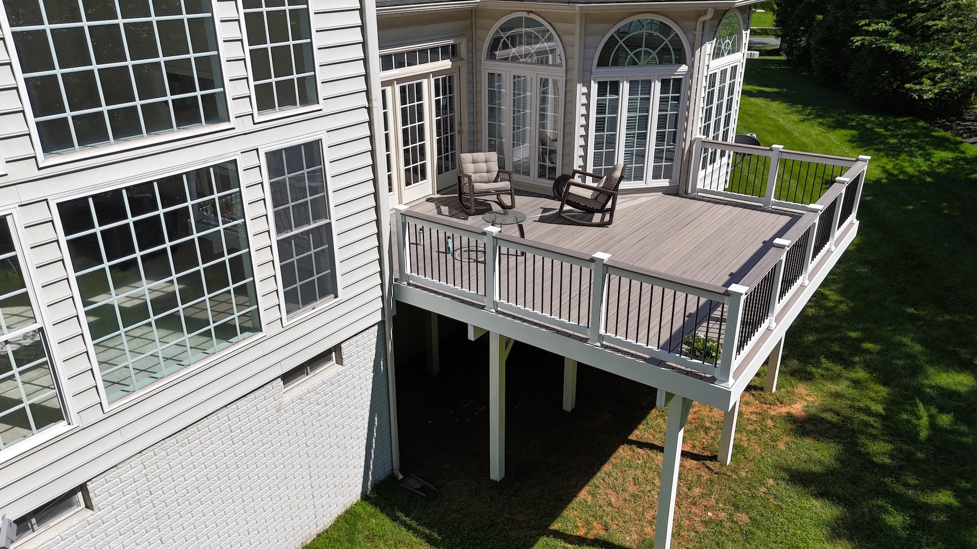 Upgryd Trex Rocky Harbor deck side view in Bethlehem PA showcasing Trex decking and railing.
