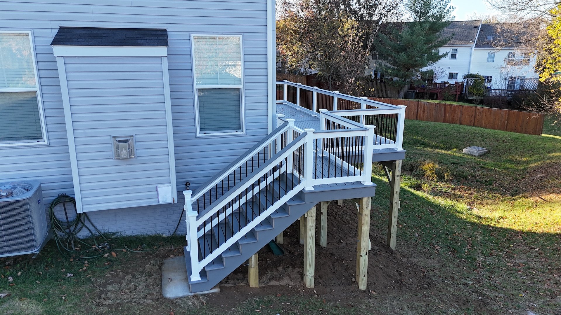 Upgryd deck with white vinyl railings and staircase in Cetronia, PA.