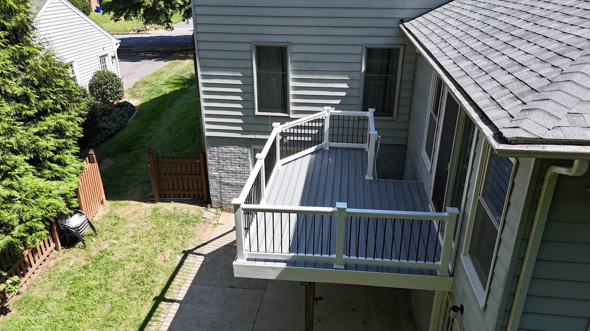 Upgryd's Trex deck enhances a foggy wharf's elevated deck design, blending seamlessly with the waterfront's atmosphere.