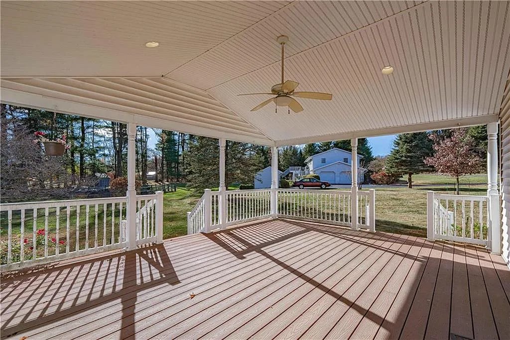 Upgryd covered deck with a ceiling fan in Lehigh Valley PA, perfect for outdoor relaxation and entertainment.