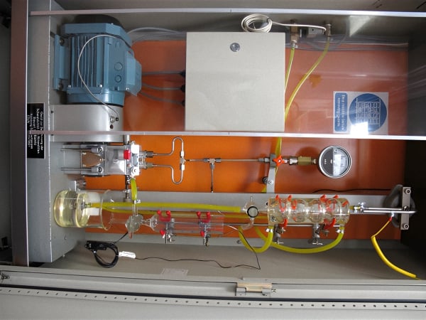 A picture of the Kurt Orbahn diesel injector shear bench test, a frequently used test to quantify permanent shear stability. It measures the permanent reduction in an oil’s viscosity after 30 cycles through the test apparatus.