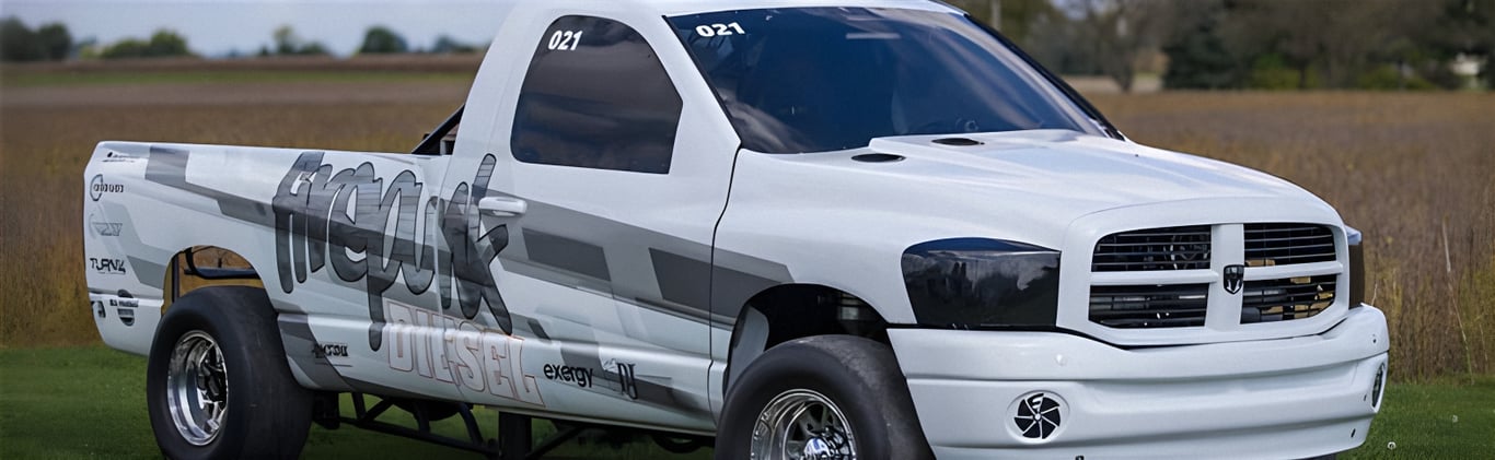 An image of a diesel powered white racing pickup truck that is fully protected using our Fleece Freedom Series 100% synthetic premium diesel engine oil.