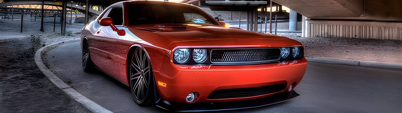 An image of a red high-performance Dodge Challenger SRT Hellcat. AMSOIL Extended Life Premium Synthetic Motor Oil is formulated to protect high-powered sports cars like this Challenger Hellcat.