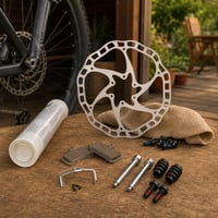 Kit Mentență Frâne: disc 180mm + plăcuțe + set bucșe ghidaj + spray lubrifiant 1