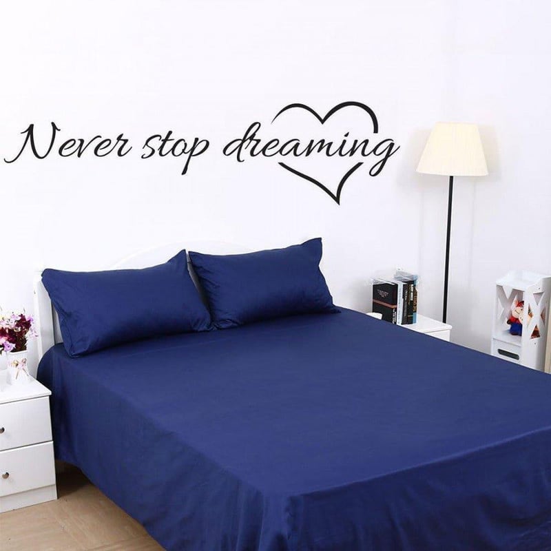 Inspiráló "Never stop dreaming" fali dekor tábla 57x16,5 cm