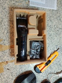 Aparat de tuns Philips QC5115/15 pentru întreaga familie, cu lame din oțel inoxidabil, 11 setări de lungime, utilizare cu fir, vizibil utilizat 2