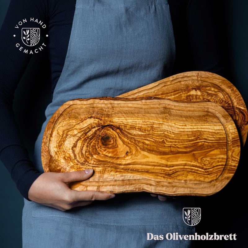 das Olivenholzbrett olíva fa vágó- és tálalódeszka léelvezető barázdával, fogantyú kivágással bal és jobb oldalon, 40-44 x 20-21 cm
