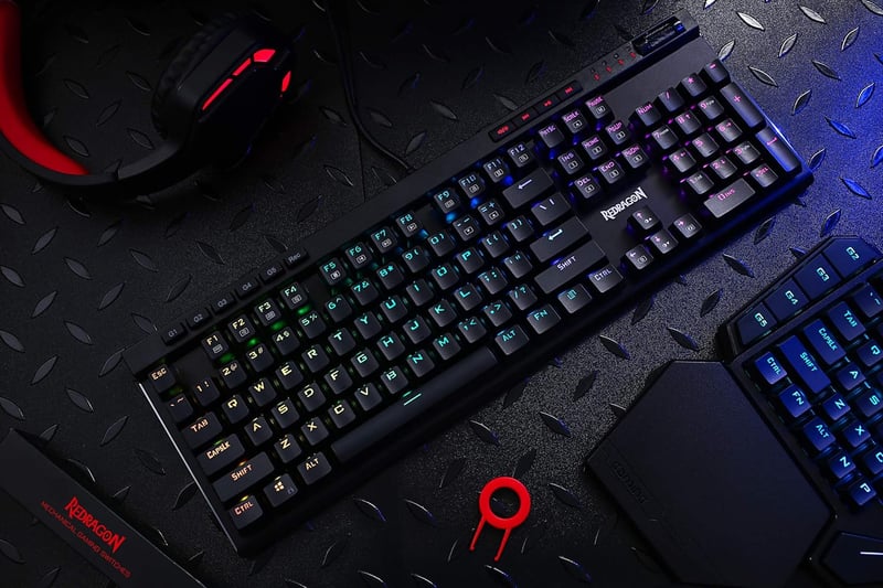 Redragon K580 VATA RGB LED Mechanikus Gamer Billentyűzet Kék Kapcsolókkal, Háttérvilágítással, Makró Gombokkal és Médiakonzollal, PC/Mac Kom