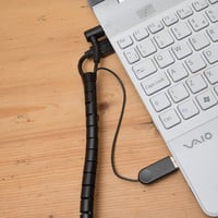 Fekete Spirál Kábelrendező Visszahúzható Segédlettel - Praktikus Kábelszervező 9