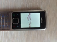 Mobilný telefón Nokia 6300 bez blokovania – čierno-strieborný, 2 Mpx fotoaparát, Bluetooth, FM rádio, hudobný prehrávač, 7,8 GB 5