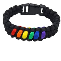 TUYOBG dúhový paracord náramok na prežitie s plastovou prackou - dúhový 1