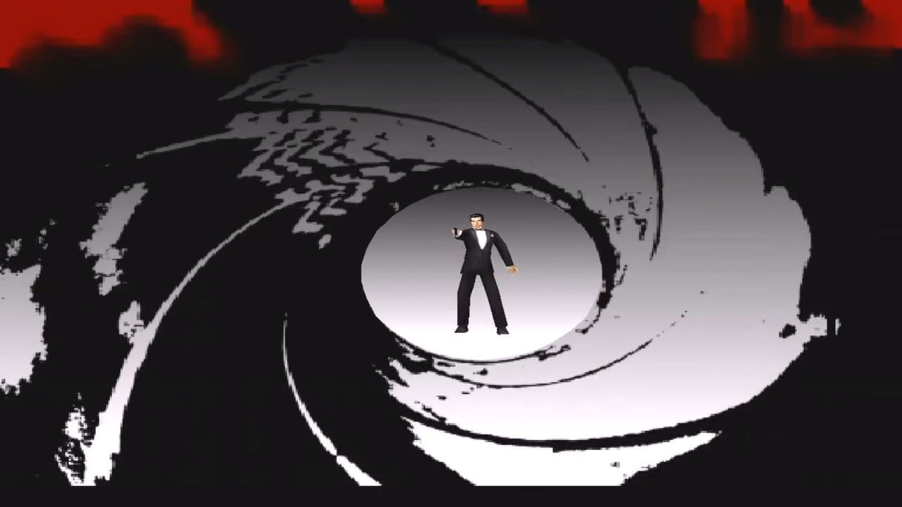 A man in a black tuxedo stands in the center of a spiraling gun barrel tunnel. The barrel features concentric circular patterns in black, white, and gray, creating a deep perspective effect. The tunnel walls show map-like geographical details on the left side. The background above transitions from dark to red tones. The character is rendered in low-polygon 3D model style typical of early Nintendo 64 graphics.