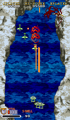 A vertical scrolling shooter arcade screen displays a blue ocean setting with layered wave patterns. A yellow player aircraft appears in the lower-center area alongside a blue ally plane. Red enemy formations and projectiles are visible in the middle section. The UI shows "VITAL 90" and "5-SHELL" in the lower-left corner, with "HI-SCORE 03500" and "2 PLAYER" text at the top. The right margin displays tan stone or cliff texturing, creating a bordered frame around the gameplay area.