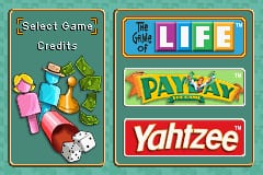 A menu screen displays three game titles arranged vertically on the right side: The Game of Life with a colorful logo at top, Payday in yellow text in the middle, and Yahtzee in red text at bottom. On the left side sits a green panel labeled "Select Game" with Credits below it, featuring illustrated game pieces including colorful tokens, dice, and other board game components scattered across the lower portion of the left panel.