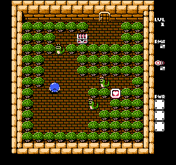 A top-down puzzle room with a tan brick border frames a grass-filled interior. A blue character sprite occupies the center-left area, while a red spherical enemy appears in the middle-right. Several brown chest or block sprites are scattered throughout the grassy floor. A small white object floats near the upper-center portion of the playfield. The right edge displays a vertical status panel with four colored icons and text labels in a small bitmap font. The overall 8-bit sprite resolution and limited color palette are characteristic of NES-era graphics.