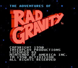 The title screen displays large red pixelated text reading "RAD GRAVITY" centered against a black starfield background. Below the title, white copyright text reads "COPYRIGHT 1990 INTERPLAY PRODUCTIONS" followed by licensing information for Mindscape and Nintendo of America, with all rights reserved noted at bottom. Small white dots representing stars are scattered across the black background, and the overall visual uses a classic NES-era 8-bit art style with limited color palette.