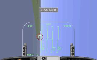 A top-down aerial combat view displays a blue gridded airfield with a 'PAUSED' label at the top center. Two black aircraft silhouettes occupy the left and right edges of the screen. A centered targeting reticle with crosshairs marks the play area. Numerical displays show 'S96' on the upper left, 'U9601' on the upper right, and 'SEEO' with '0' on the lower left. The HUD elements use cyan and white text against the blue background, with a low-resolution pixel art style typical of early 1990s DOS games.