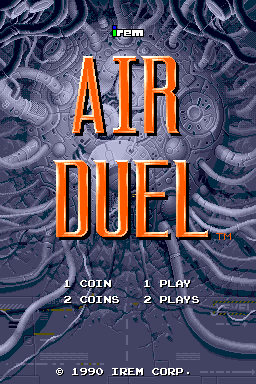 The title screen displays "AIR DUEL" in large orange capital letters centered on screen, with a gray swirling abstract background pattern. Above the title, "IREM" appears in small white text. Below, four menu options are listed in white: "COIN 1" and "2 COINS" on the left, and "1 PLAY" and "2 PLAYS" on the right. Copyright text "© 1990 IREM CORP." is positioned at the bottom in white. The overall design uses a dark blue-gray color scheme with high-contrast orange lettering typical of arcade title screens from this era.