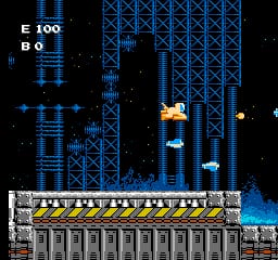 A spaceship with yellow and orange plating flies through a blue gridded fortress structure filled with multiple platforms and architectural sections. The player's craft appears in the center-right area against a black starfield background. A score display reading "E 100" and "BO" sits in the upper left corner. The fortress features layered blue geometric frameworks with yellow striped warning sections across the lower portion, creating a vertically-oriented level design with distinct platform tiers and structural obstacles throughout the scene.